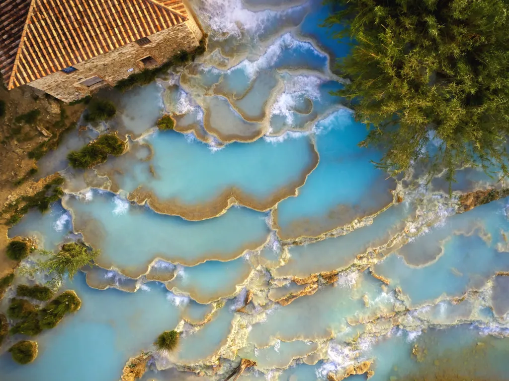 saturnia hot spring in tuscany as seen from above, one of the best things to do in tuscany italy