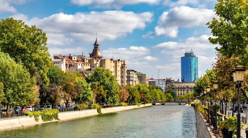 view of bucharest skyline with the river in the foreground, near many of the best things to do in bucharest romania