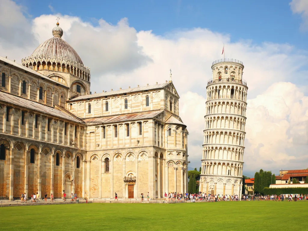 leaning tower of pisa italy with baptistery visible to the left