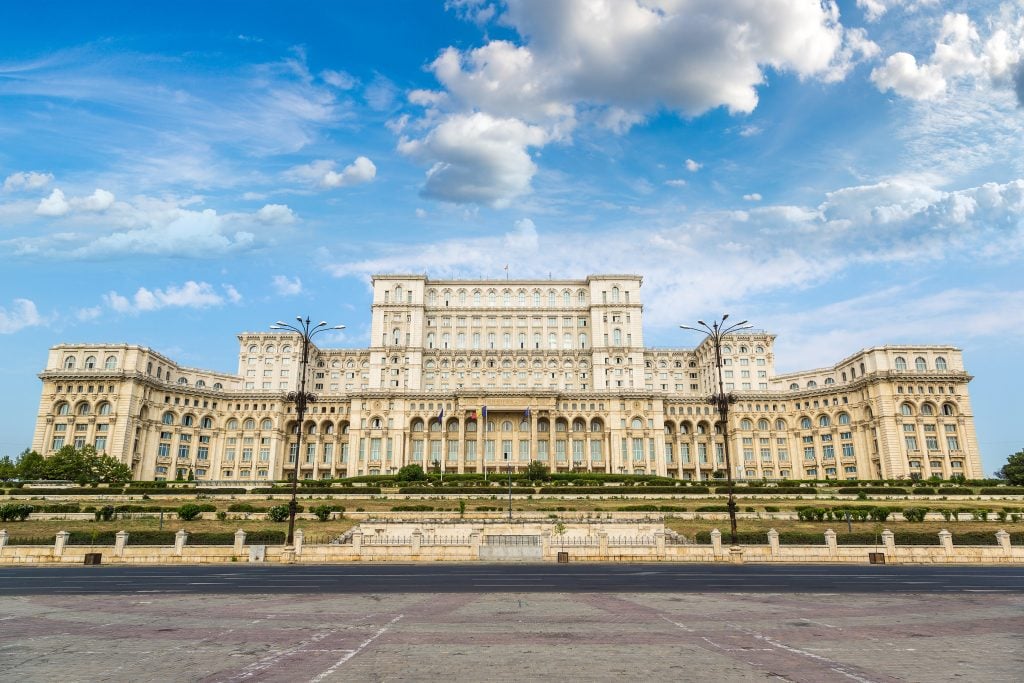 dead on view of front facade of romania parliament, one of the best things to do in bucharest romania