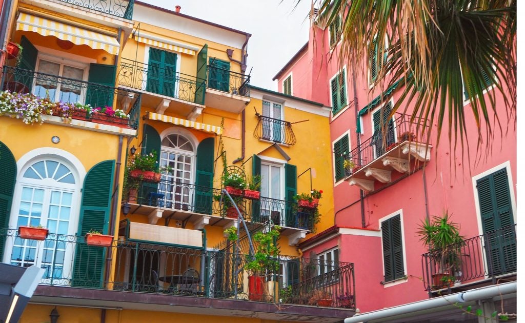 colorful yellow and pink buildings along italian riviera