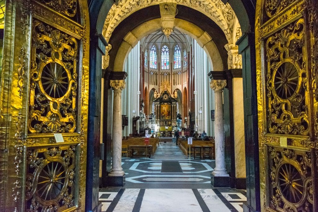 golden doors marking entrance to church and leading into sanctuary in brugge belgium