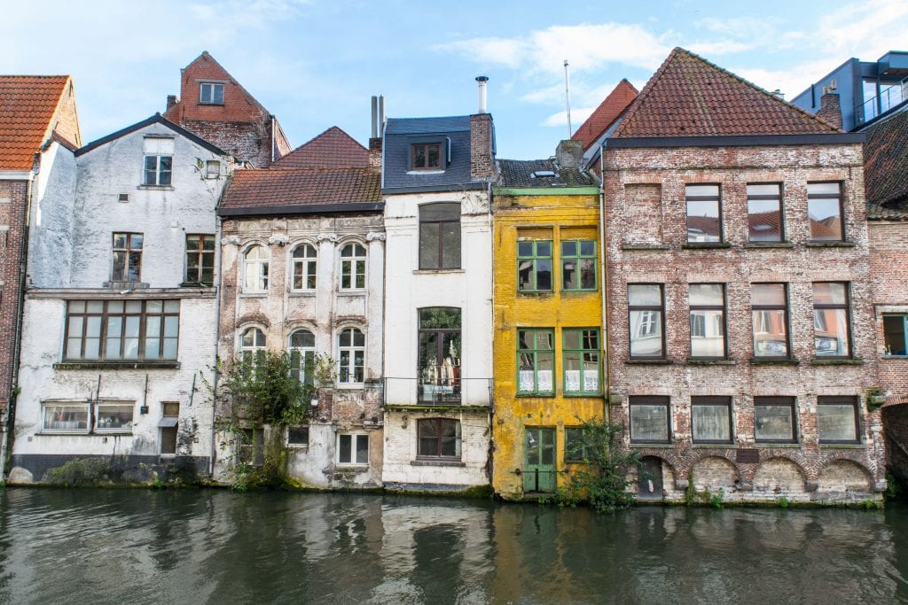 view of buildings lining a canal in ghent belgium