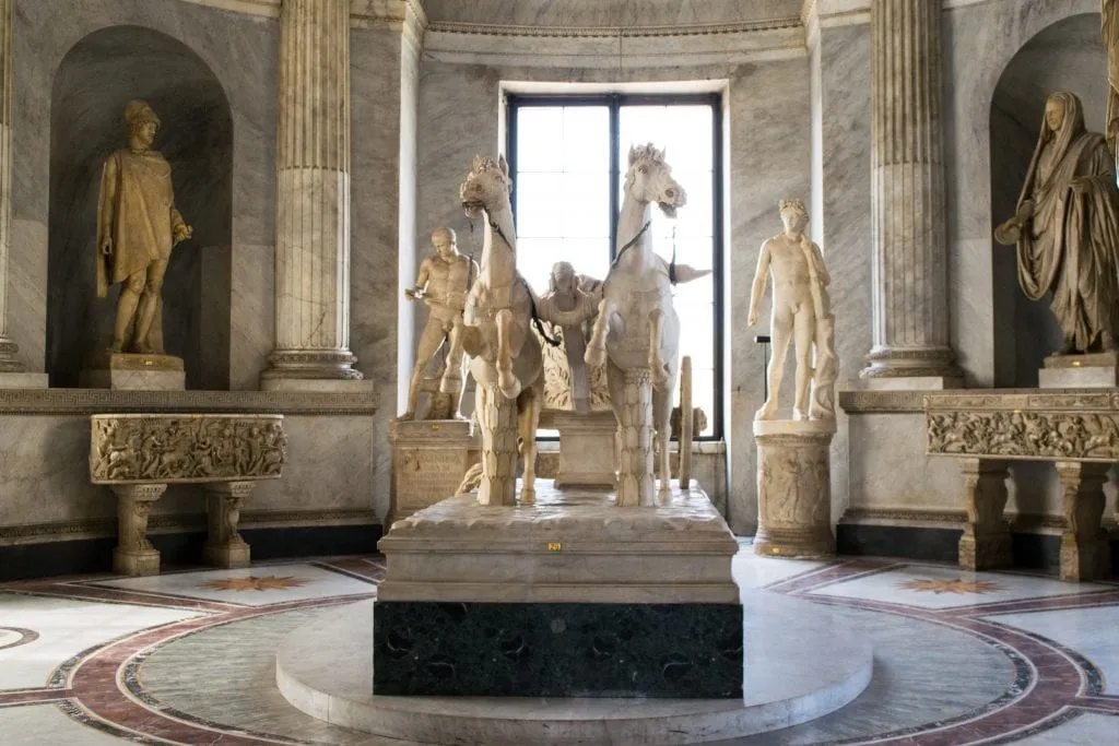 marble statues on display in the vatican museums