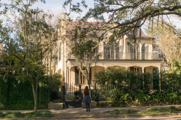 kate storm standing in front of garden district mansion during a long weekend in new orleans
