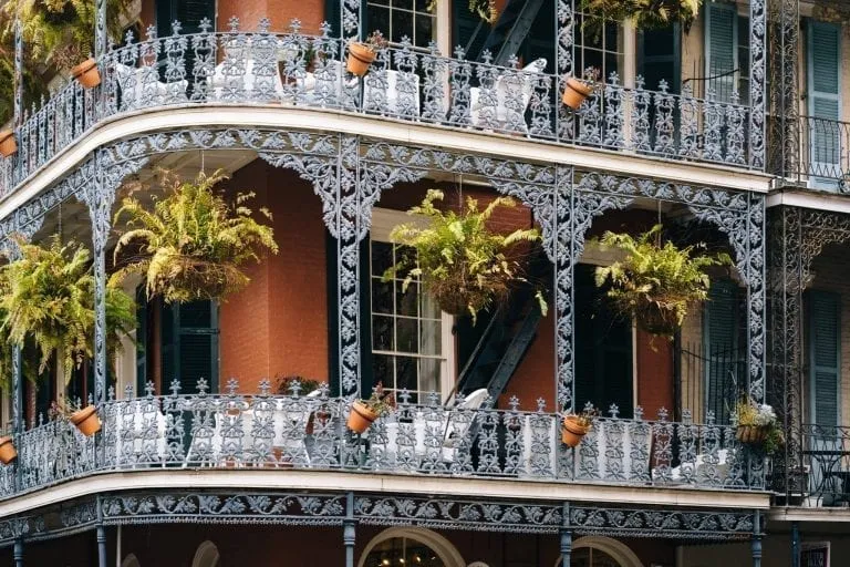 close up shot of wrought iron balconies in the french quater of New Orleans--you'll see plenty of beautiful corners like this throughout your 3 days in New Orleans itinerary!