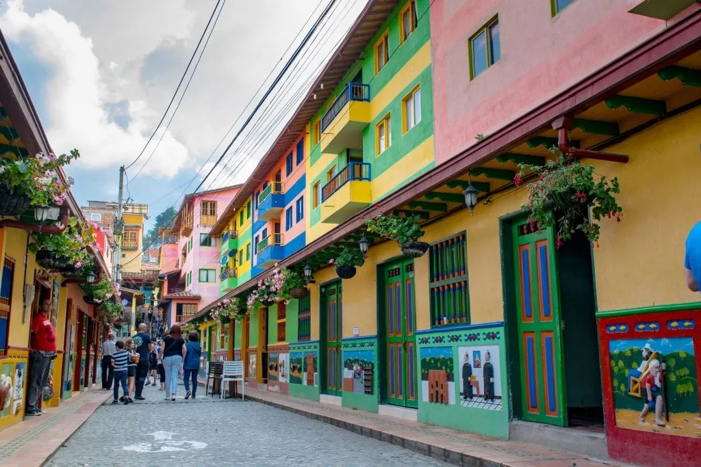 colorful street in guatape colombia, where airbnb host tips include helping guests easily find the property