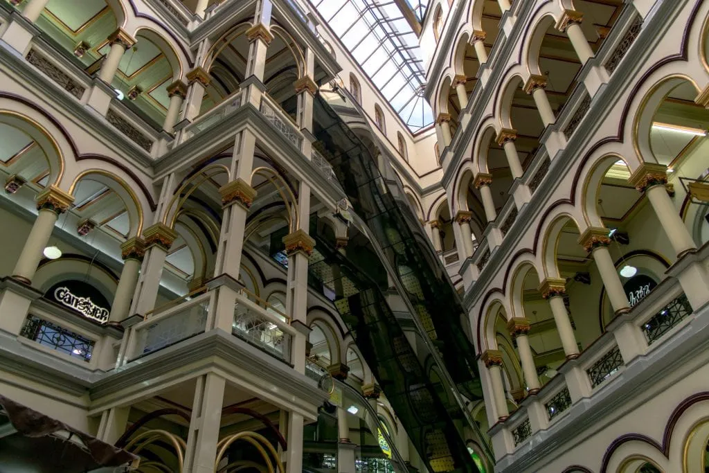 interior of a modern mall in Medellin Colombia, with escalators showing. As visited during our personal trip to Colombia itinerary