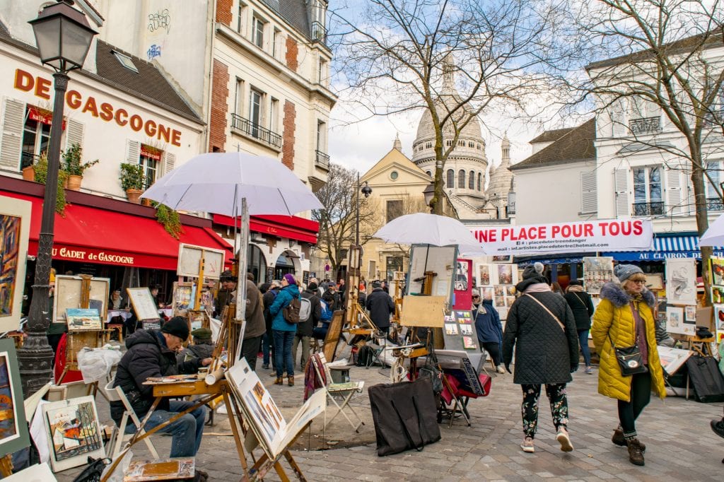 artists set up under umbrellas in place du tertre