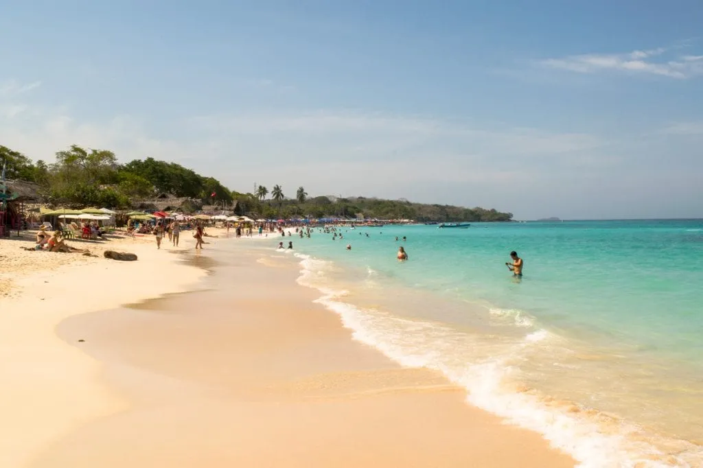 crowds of swimmers on playa blanca cartagena