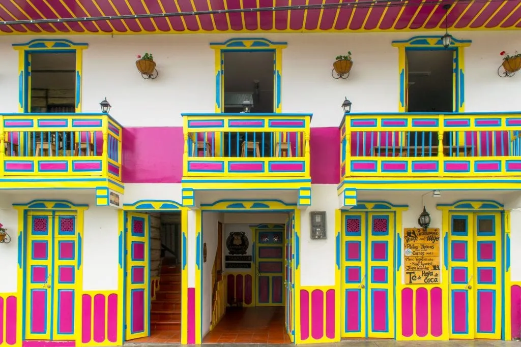 bright yellow, pink, and white building--snapping photos like this is one of our favorite parts of a 2 weeks in Colombia itinerary.