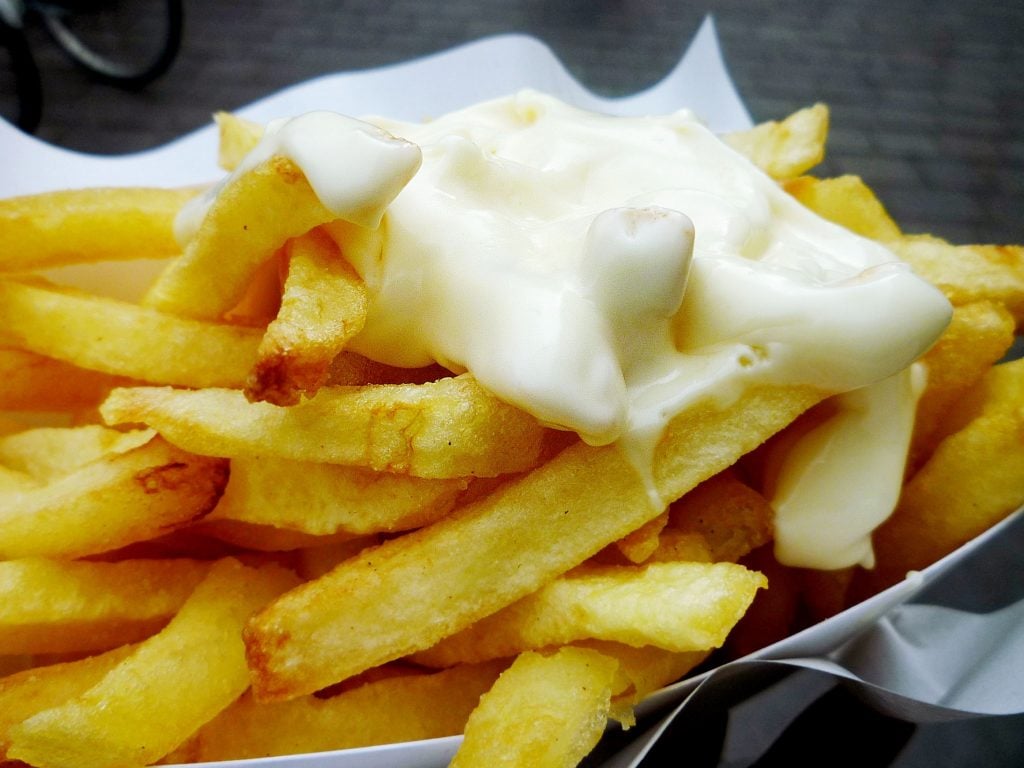 basket of belgian frites topped with belgian mayo