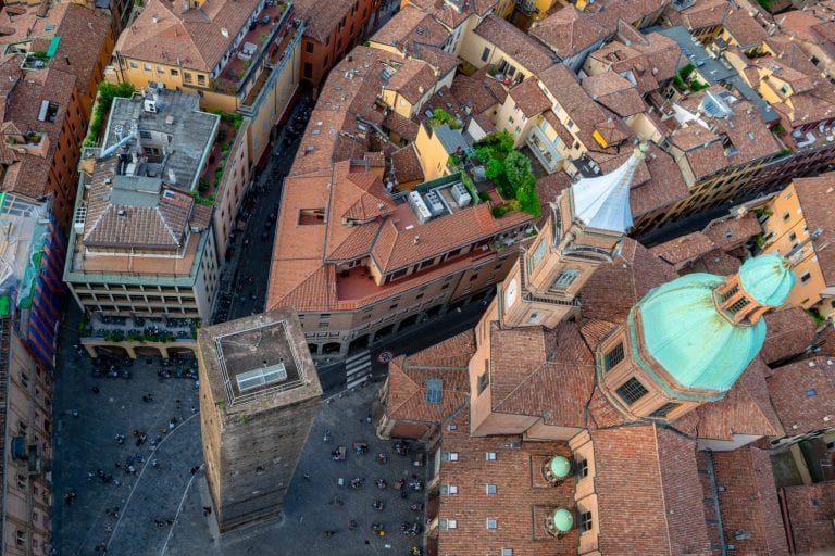 view of garisenda tower from asinelli tower, one of the best things to do with one day in bologna italy