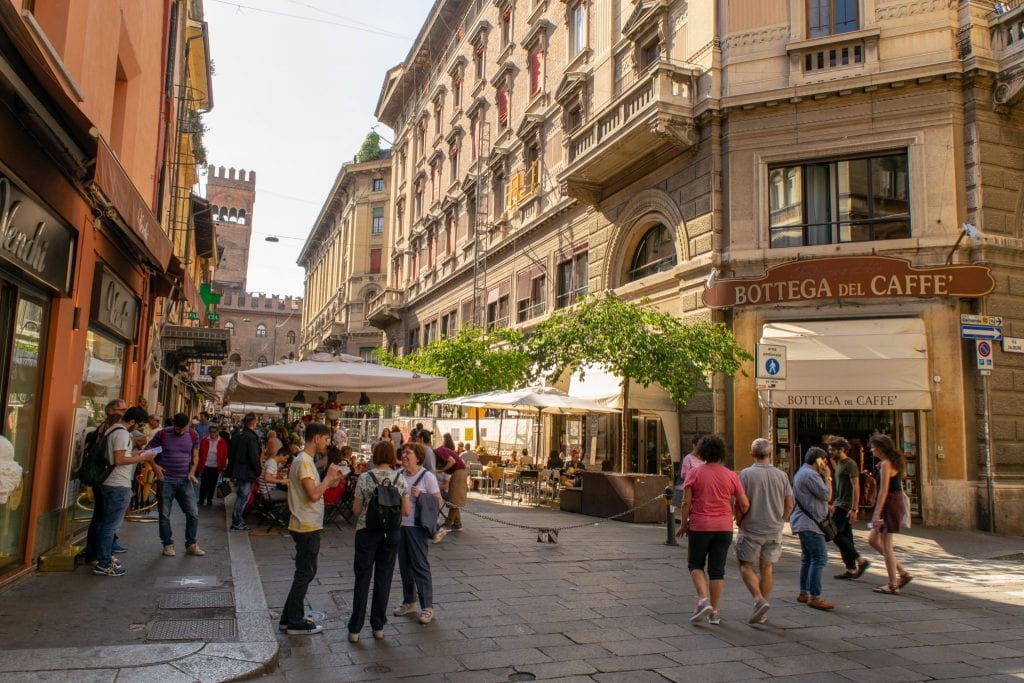 People wandering through street in Bologna, Florence to Bologna Train