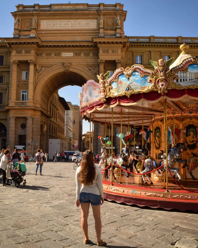 kate storm in front of carousel in piazza repubblica, one of the best florence photo spots
