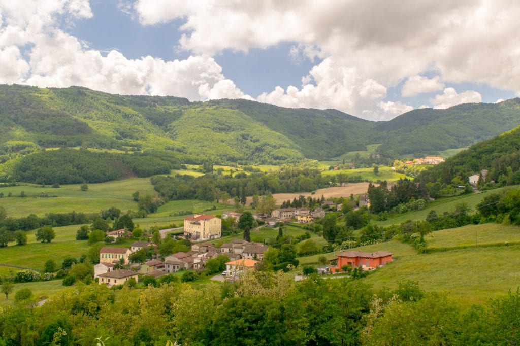 emilia romagna countryside with small village in a valley