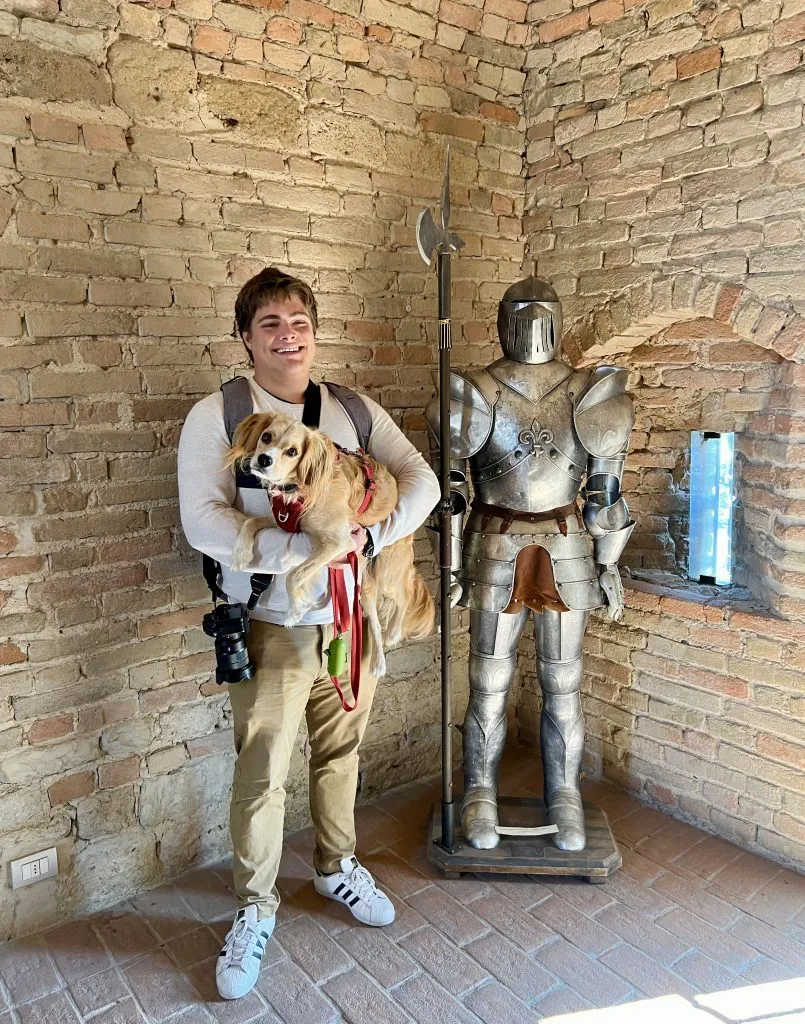 jeremy storm and ranger storm posing with a suit of armor inside the fortress museum