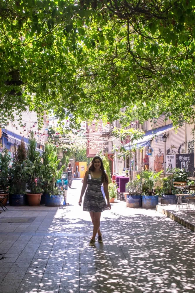 kate storm on a side street in istanbul turkey with a green canopy over it