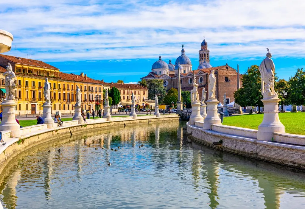 Prato della Valle under blue skies in padua italy, a fun day trip option