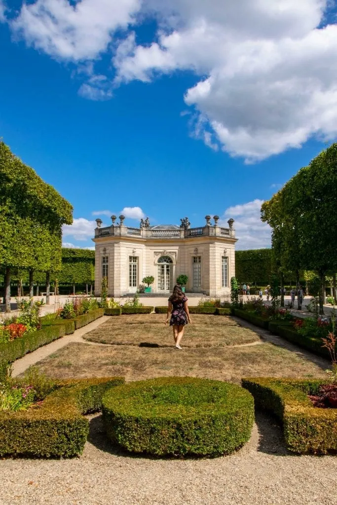 kate storm on the grounds of versailles enjoying a day trip to versailles from paris france