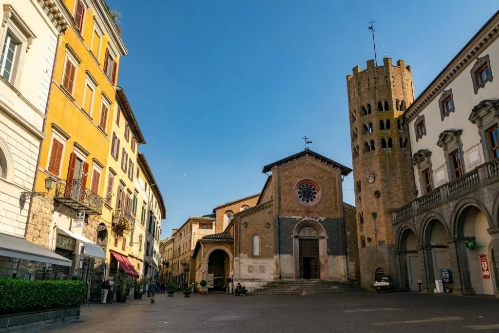 small Piazza della Repubblica in orvieto italy with a church and tower