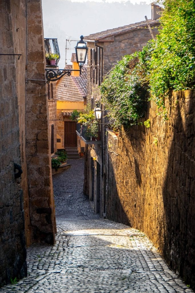 empty cobblestone street leading downhill in orvieto italy