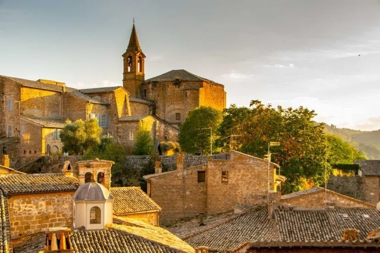 stone buildings of orvieto italy at sunset, one of the best things to do in orvieto italy