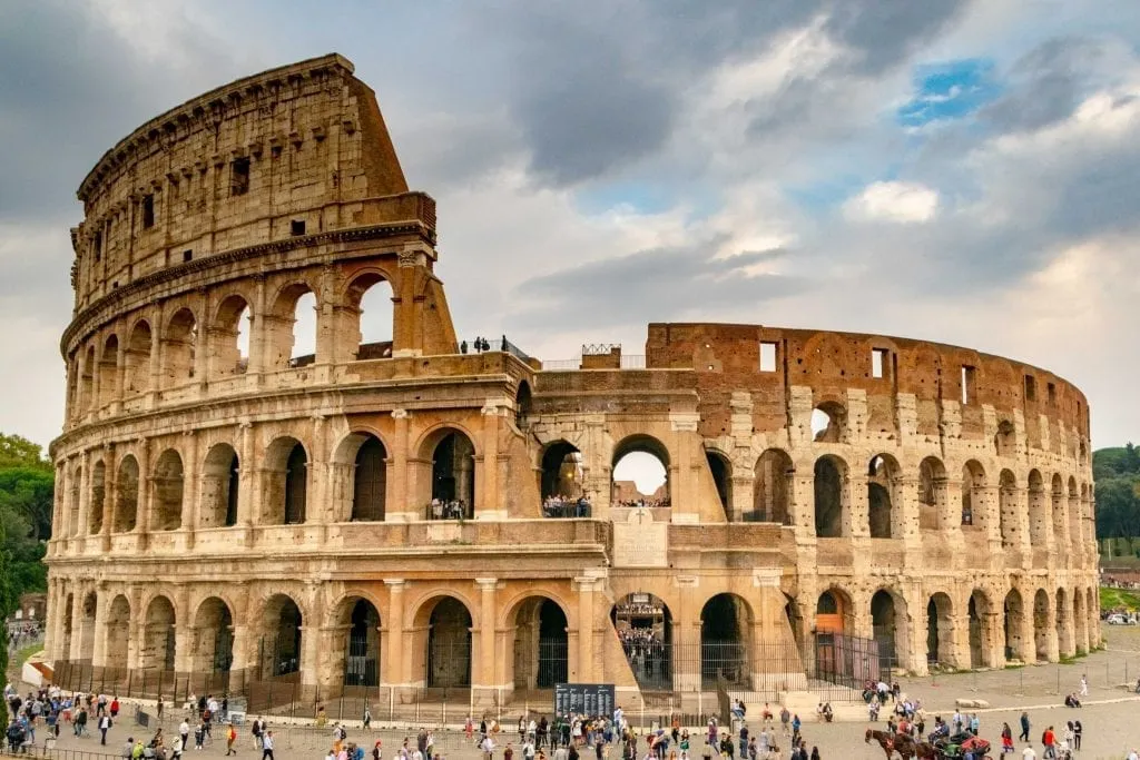 colosseum in rome italy on a cloudy day, an italy bucket list destination