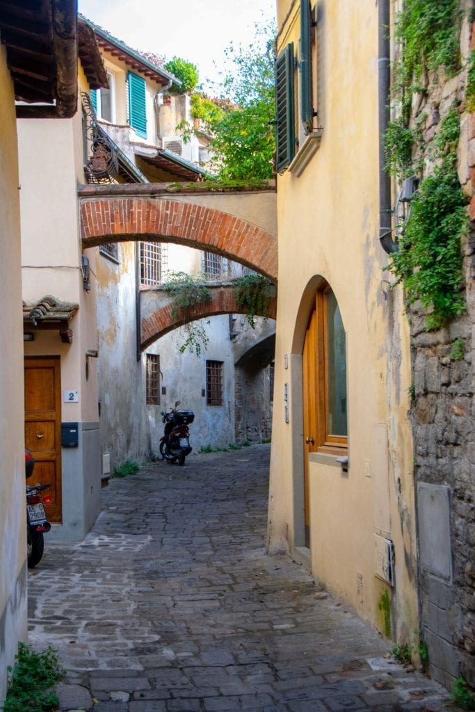 view of empty cobblestone street in florence italy