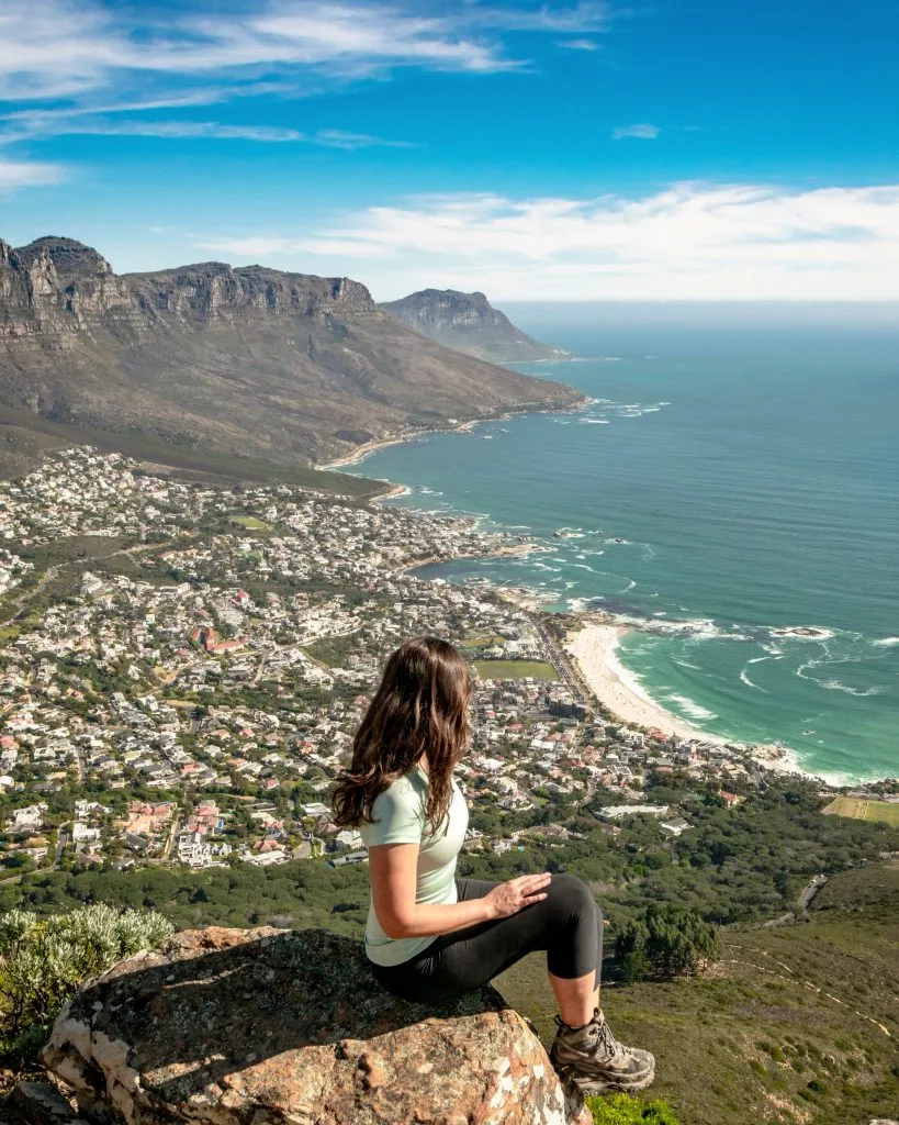 kate storm overlooking the coast while hiking lions head cape town