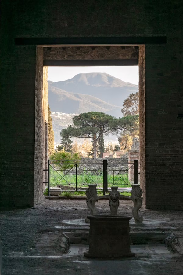 view of mount vesuvius as seen through a doorway in pompeii italy