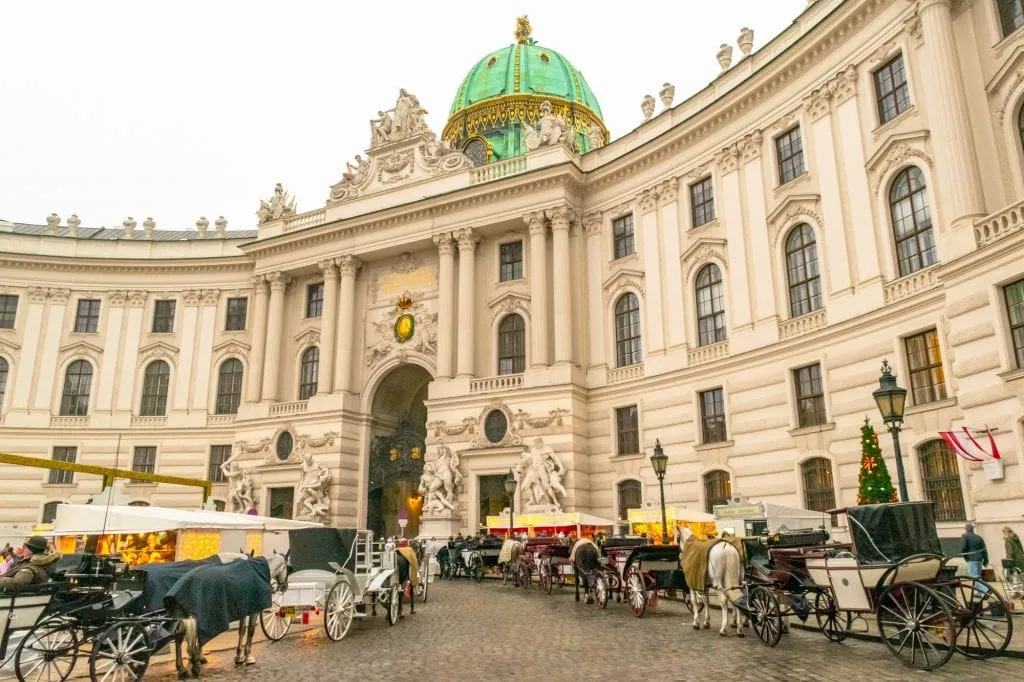 Vienna Spanish Riding School exterior with horses parked out front