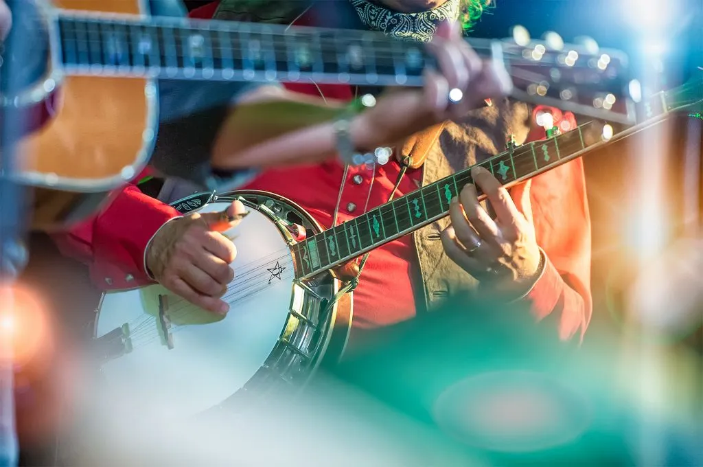 close up of banjos being played