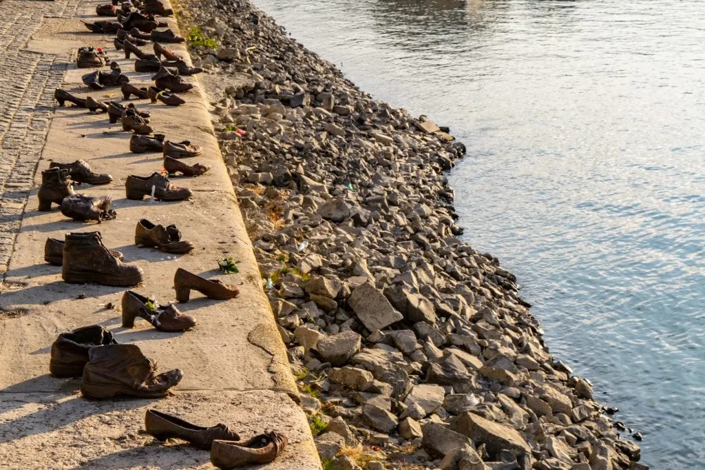 Many brass shoes at the Shoes on the Danube Monument in Budapest--even if you're trying to see Budapest in a day, be sure to pay your respects at this somber place.