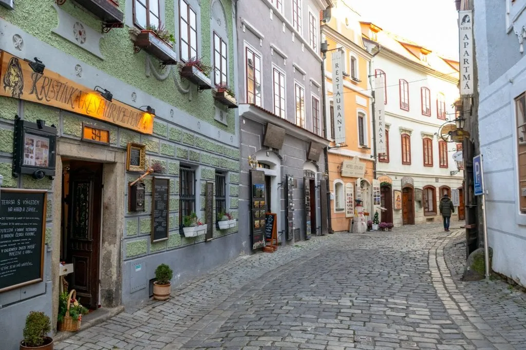 cobblestone street with colorful buildings during Winter in Český Krumlov
