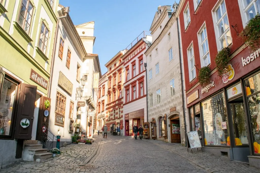 colorful street of cesky krumlov in winter on a sunny day