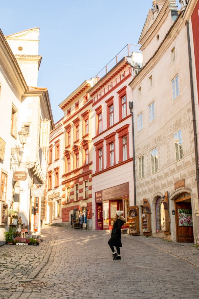 kate storm on a street in cesky krumlov winter morning