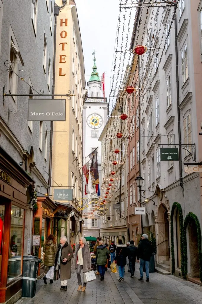 view of aldstadt salzburg in winter with a clock tower in the center of the image