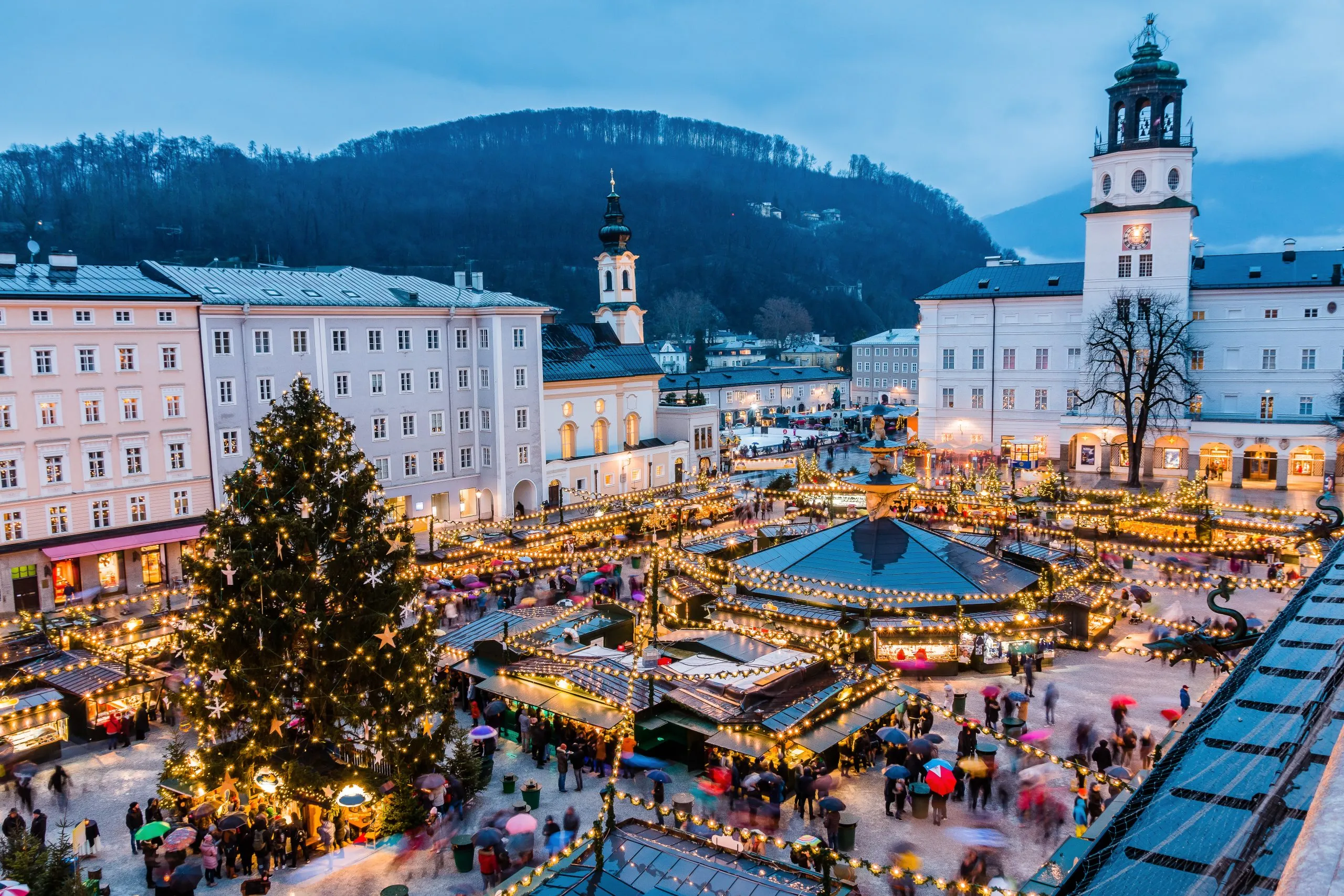 view of salzburg christmas market from above at night, one of the best things to do in salzburg in the winter