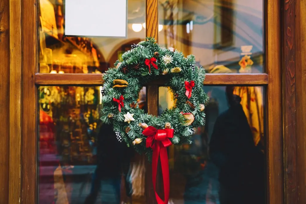 christmas wreath in the window of a cozy cafe, one of the best things to do cesky krumlov winter