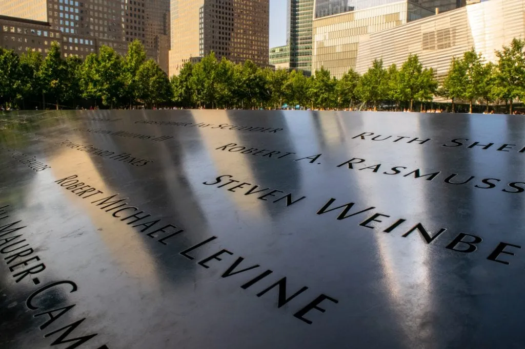 close up of names engraved on 9/11 memorial in financial district nyc itinerary