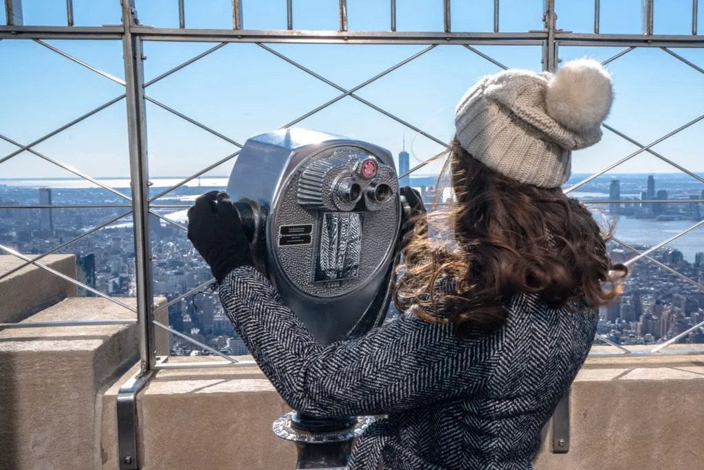 Empire State Building or Top of the Rock: Girl with Binoculars on Empire State Building