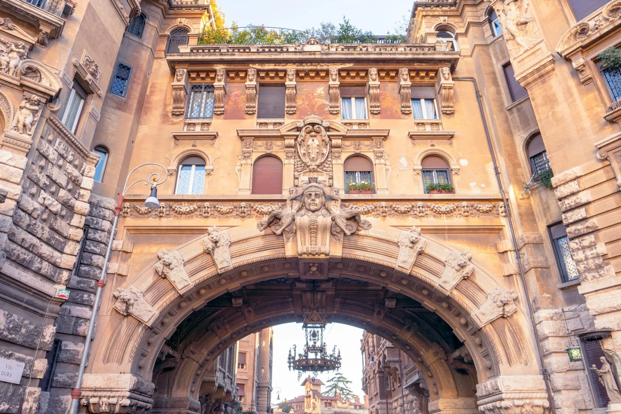 Close-up photo of Quartiere Coppedè entrance gate in Rome.