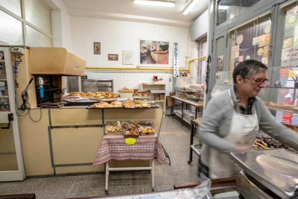 Interior of Biscottificio Artigiano Innocenti with 1950s oven, as seen during a food tour in rome italy