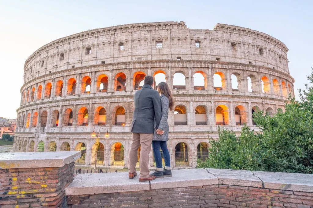 Couple in front of Colosseum: Visiting Rome in Winter