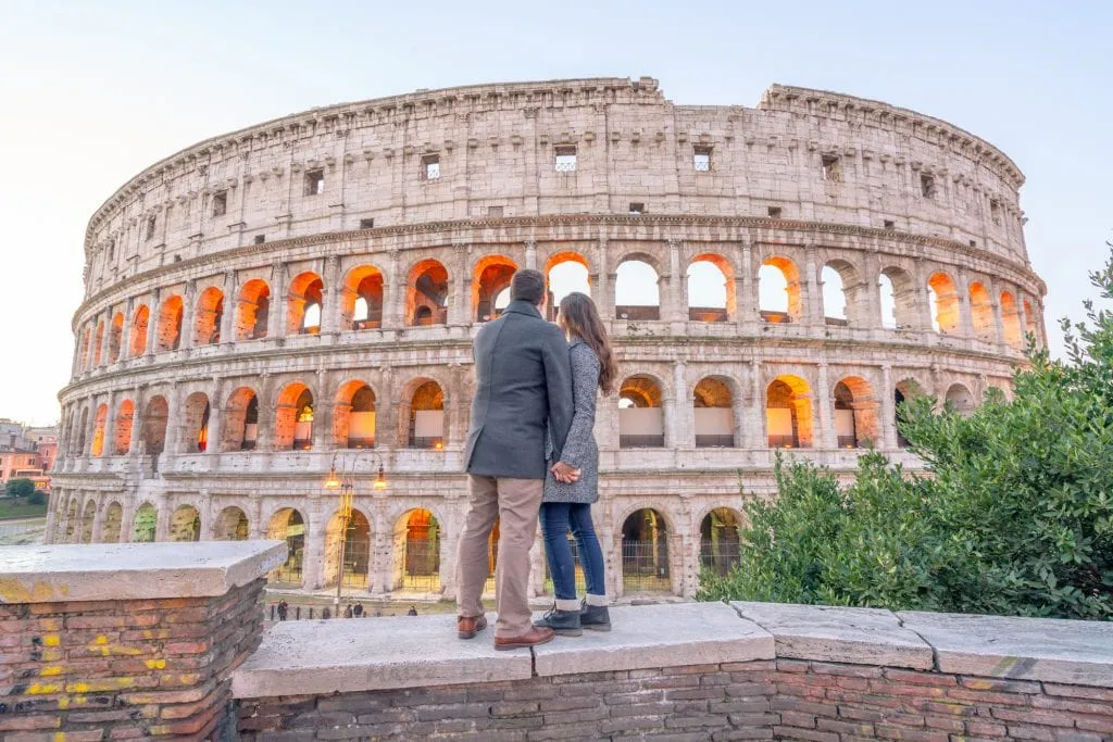 Couple standing in from of Colosseum, One Day in Rome -- Rome in a Day