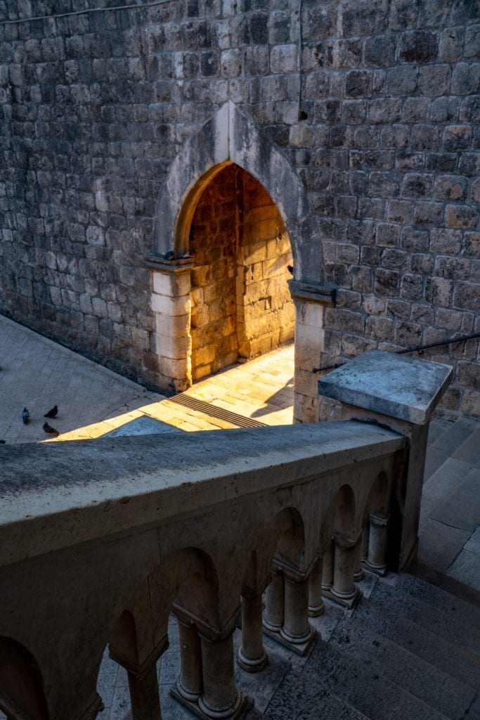 interior of pile gate with light shining through, one of the best places to visit in dubrovnik croatia