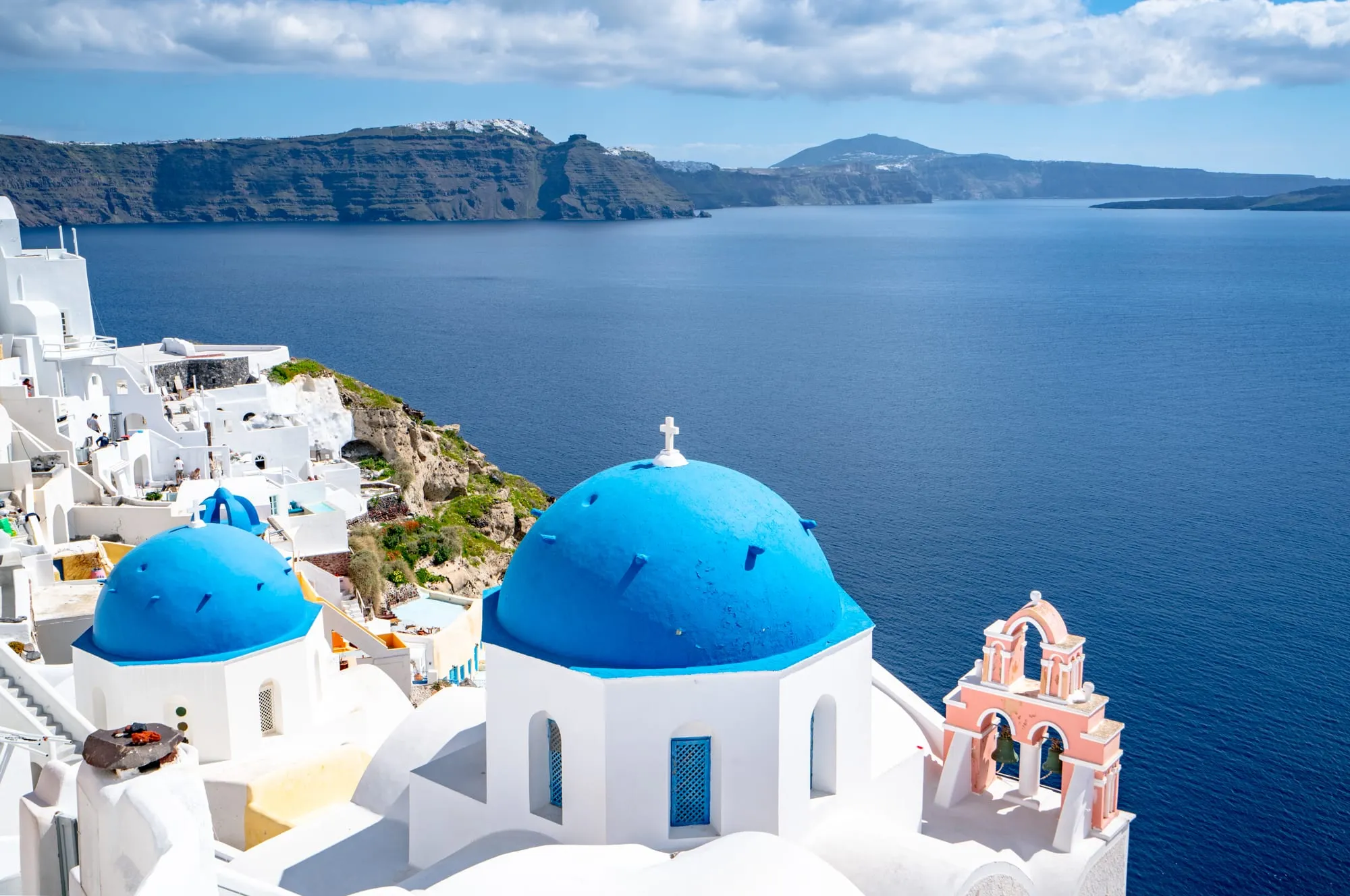 blue domes of oia santorini, one of the best places to visit when traveling to europe for the first time