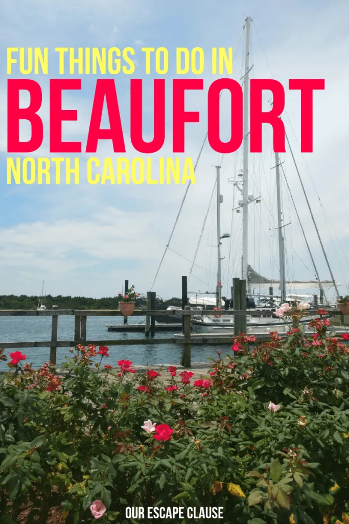 sailboat anchored in beaufort with flowers in the foreground, yellow and pink text reads "fun things to do in beaufort north carolina"