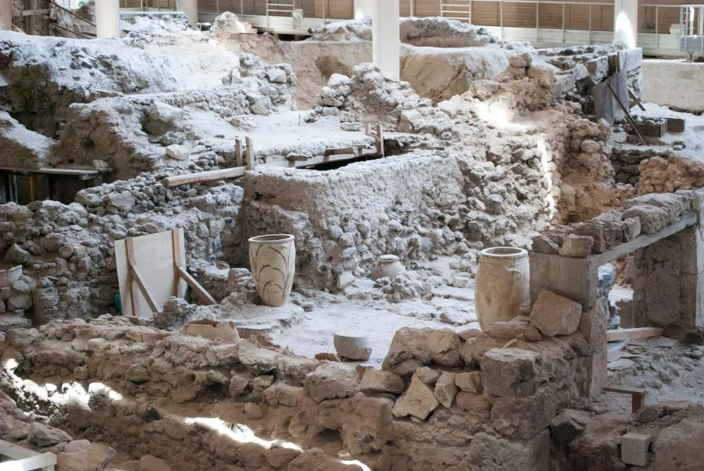 archaeological site akrotiri as seen during an itinerary santorini 3 days. pots are visible amongst the building ruins